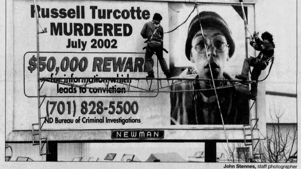 Billboard offering ,000 reward for information in the murder of Russell Turcotte